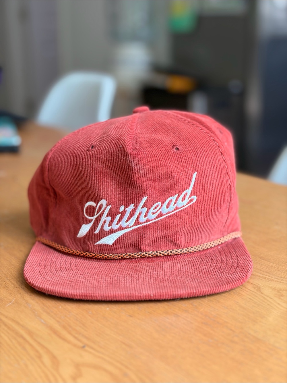 “Shithead” Red Corduroy Script Snapback Cap with Rope Trim